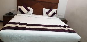 Postel nebo postele na pokoji v ubytování Hotel Le Castle