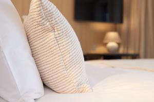 Postel nebo postele na pokoji v ubytování C-Hotels Silt