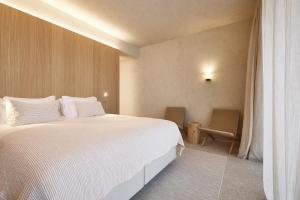 Postel nebo postele na pokoji v ubytování C-Hotels Silt