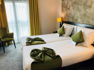 Tempat tidur dalam kamar di Best Western Allegro Nation