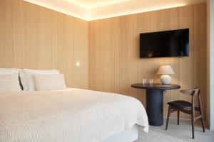 Postel nebo postele na pokoji v ubytování C-Hotels Silt