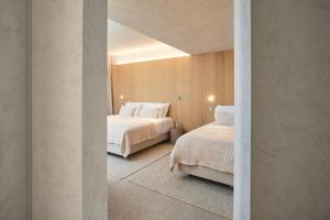 Postel nebo postele na pokoji v ubytování C-Hotels Silt