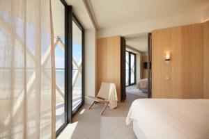 Postel nebo postele na pokoji v ubytování C-Hotels Silt