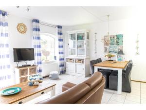 a living room with a couch and a table at Residence Juliana 68 in Julianadorp