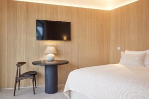 Postel nebo postele na pokoji v ubytování C-Hotels Silt