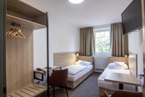 Postel nebo postele na pokoji v ubytování Hotel Avion