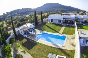 an aerial view of a villa with a swimming pool at Villa Olympos Ladiko in Kalithies