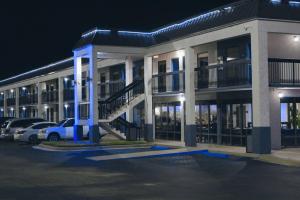 a building with a staircase in a parking lot at night at Days Inn by Wyndham Marianna in Marianna