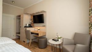 TV a/nebo společenská místnost v ubytování Hotel Rosengarten
