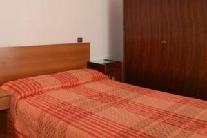 A bed or beds in a room at Annarosa