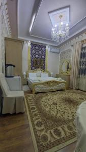Ένα ή περισσότερα κρεβάτια σε δωμάτιο στο Uyut Hotel