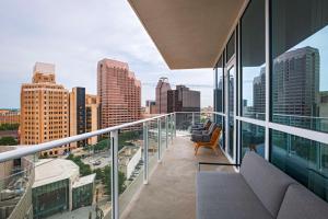 a balcony with a view of a city skyline at Thompson San Antonio - Riverwalk, by Hyatt in San Antonio
