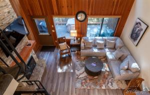 an overhead view of a living room with a couch and a clock at 93 Big Prairie in Whitefish