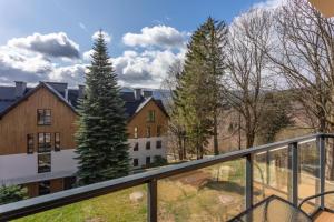 a view from the balcony of a house at Apartament B3 Green Resort z Basenem, Sauną, Jacuzzi - 5D Apartments in Szklarska Poręba