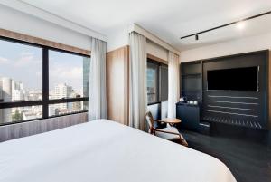 Radisson São Paulo Paulista客房内的一张或多张床位