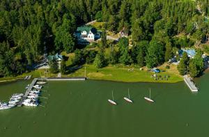 a group of boats are docked in a lake at Villa Wolax in Kaarina