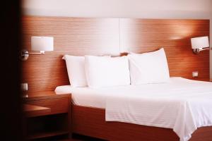 Postel nebo postele na pokoji v ubytování Hotel Jaroal
