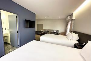 Radisson São Paulo Paulista客房内的一张或多张床位