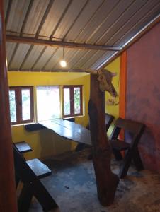 a room with a cow head on the wall at sunrise seasports in Iboih +23 photos
