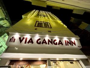 a sign for a vga camera inn at night at HOTEL VIA GANGA INN ! VARANASI ! FULLY AIR-CONDITIONED HOTEL AT PRIME LOCATION WITH ROOFTOP GANGES VIEW! 2 Min walking distance from ASSI GHAT ,NEAR KASHI VISHWANATH TEMPLE in Varanasi