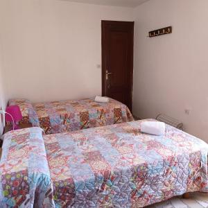 Ein Bett oder Betten in einem Zimmer der Unterkunft Pensión Rural para Peregrinos "AREAL"