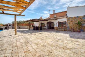 a stone patio in front of a house at Casa Stone in Benissa