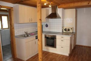 Kuchyň nebo kuchyňský kout v ubytování Äckerhof