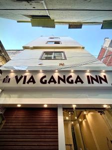 a building with a sign that reads va gaenga inn at HOTEL VIA GANGA INN ! VARANASI ! FULLY AIR-CONDITIONED HOTEL AT PRIME LOCATION WITH ROOFTOP GANGES VIEW! 2 Min walking distance from ASSI GHAT ,NEAR KASHI VISHWANATH TEMPLE in Varanasi