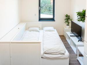 Letto o letti in una camera di Apartmány Gemini