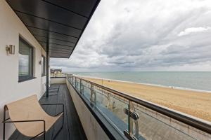 a balcony with a view of the beach at Gorgeous 2 Bed Apartment with Stunning Sea Views with Free Parking and Fast Internet in Ramsgate