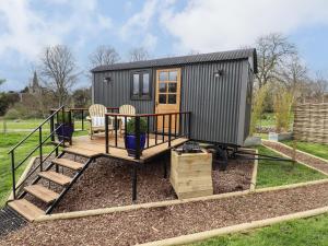 a tiny house sitting on top of a yard at Herdwick in Retford