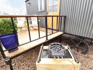 a deck with a stove on top of it at Herdwick in Retford
