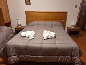 Tempat tidur dalam kamar di hotel quai