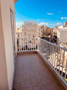 a balcony with a view of a city at Central Sliema 3bdr. Apartment in Sliema
