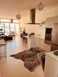 a kitchen with a zebra rug on the floor at Central Sliema 3bdr. Apartment in Sliema