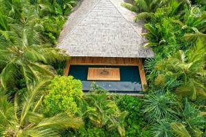 an overhead view of a house surrounded by trees at Zuri Zanzibar in Kendwa