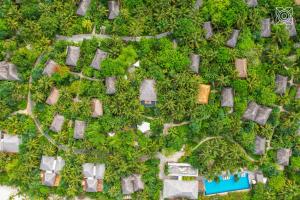 an overhead view of a garden with houses and trees at Zuri Zanzibar in Kendwa