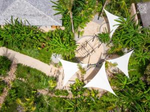 an overhead view of white kites in a garden at Zuri Zanzibar in Kendwa