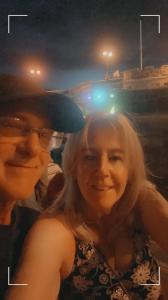 two women are posing for a picture at night at Delamere Hotel in Blackpool