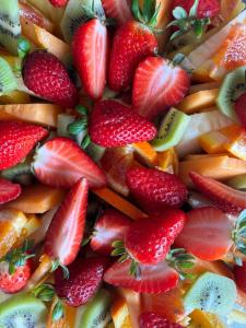 een berg aardbeien en andere vruchten op een bord bij Fanizza apartment 16 in Alberobello