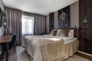 Postel nebo postele na pokoji v ubytování xhotel