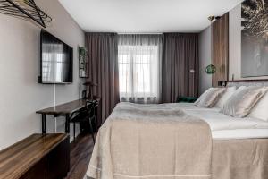 Postel nebo postele na pokoji v ubytování xhotel