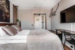 Postel nebo postele na pokoji v ubytování xhotel