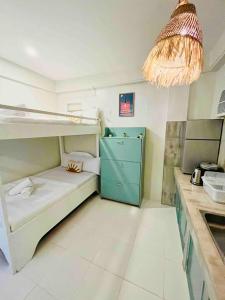 a kitchen with a bunk bed in a room at Caleo Boracay Island Station 3 in Boracay