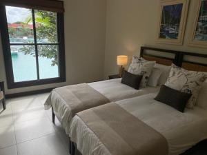 Postel nebo postele na pokoji v ubytování Papay Suite by Simply-Seychelles + 37 fotografií