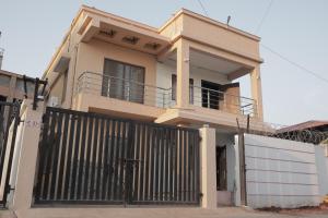 a house with a gate in front of it at Kookee Villa in Hātgarh