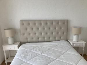 Postel nebo postele na pokoji v ubytování La belle étape proche centre ville et grande plage