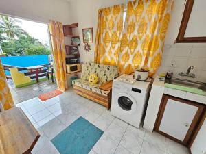 Kuchyň nebo kuchyňský kout v ubytování Tropical Apartment