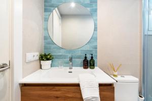 a bathroom with a sink and a mirror at Lodging Apartments Barceloneta Beach Studio 42 in Barcelona