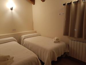 Postel nebo postele na pokoji v ubytování Rural Berrós